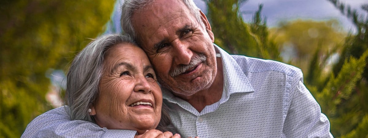 A mature couple smiling together